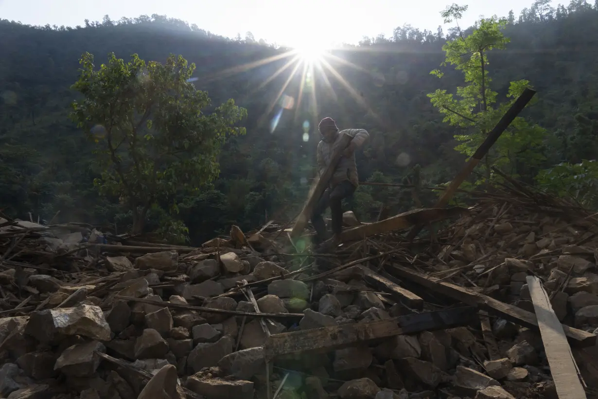 Aid trickles in as survivors salvage belongings from rubble in Nepal villages struck by earthquake