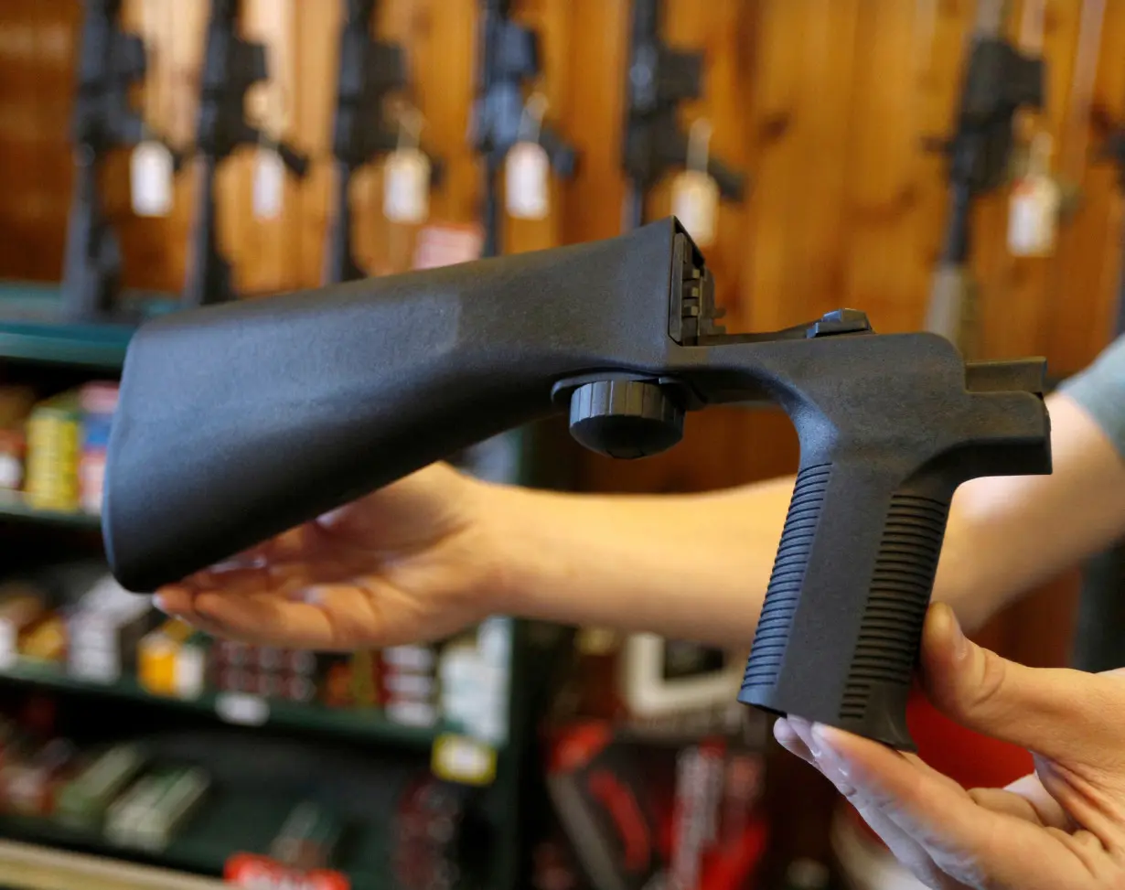 FILE PHOTO: A bump fire stock that attaches to a semi-automatic rifle to increase the firing rate is seen at Good Guys Gun Shop in Orem