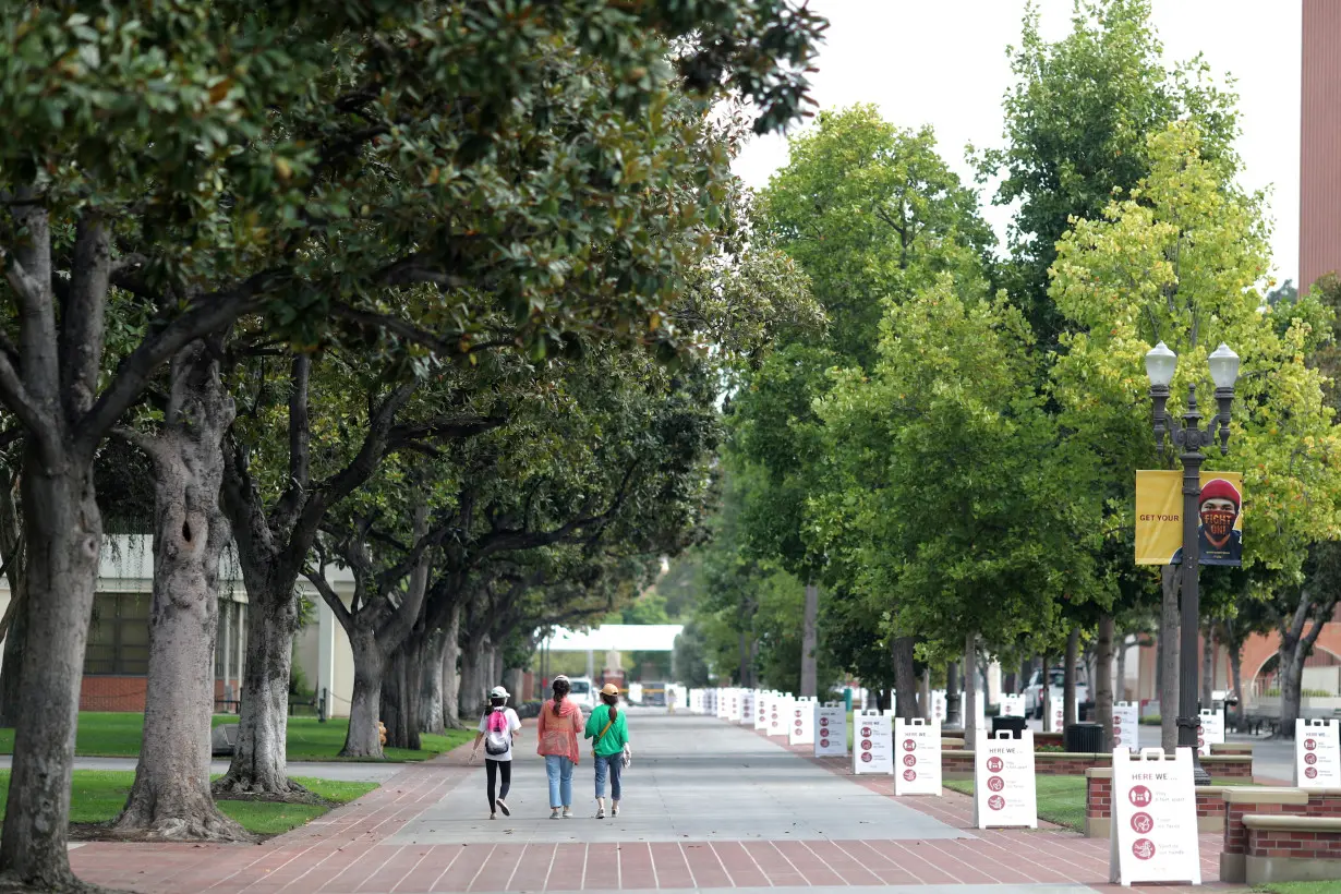 FILE PHOTO: People walk on an empty USC campus, amid the outbreak of the coronavirus disease (COVID-19), in Los Angeles