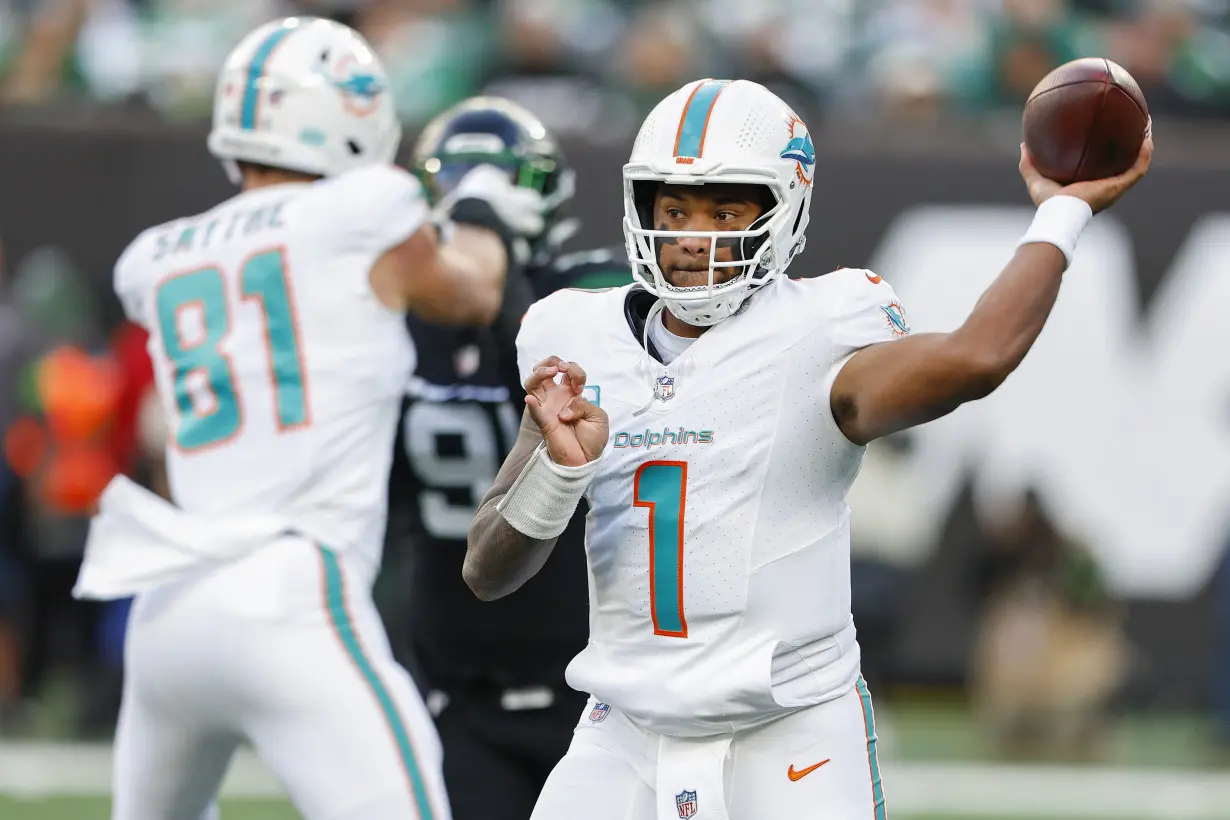 Hill's special TD catch and Holland's 99-yard INT return lead Dolphins past Jets 34-13