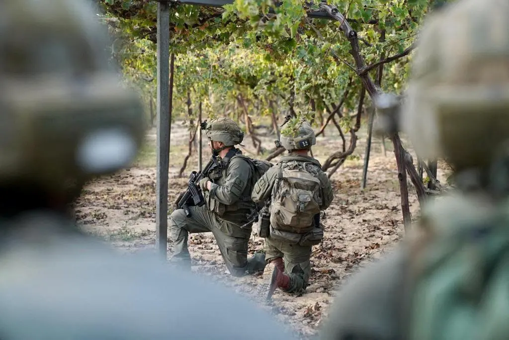 IDF handout image shows Israeli soldiers take position in the Gaza Strip