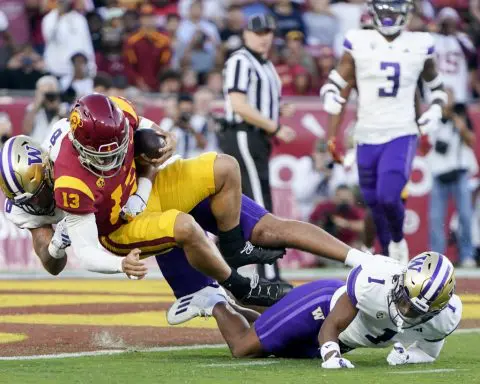 Johnson runs for 256 yards, 4 TDs in No. 5 Washington's high-octane 52-42 win over No. 24 USC