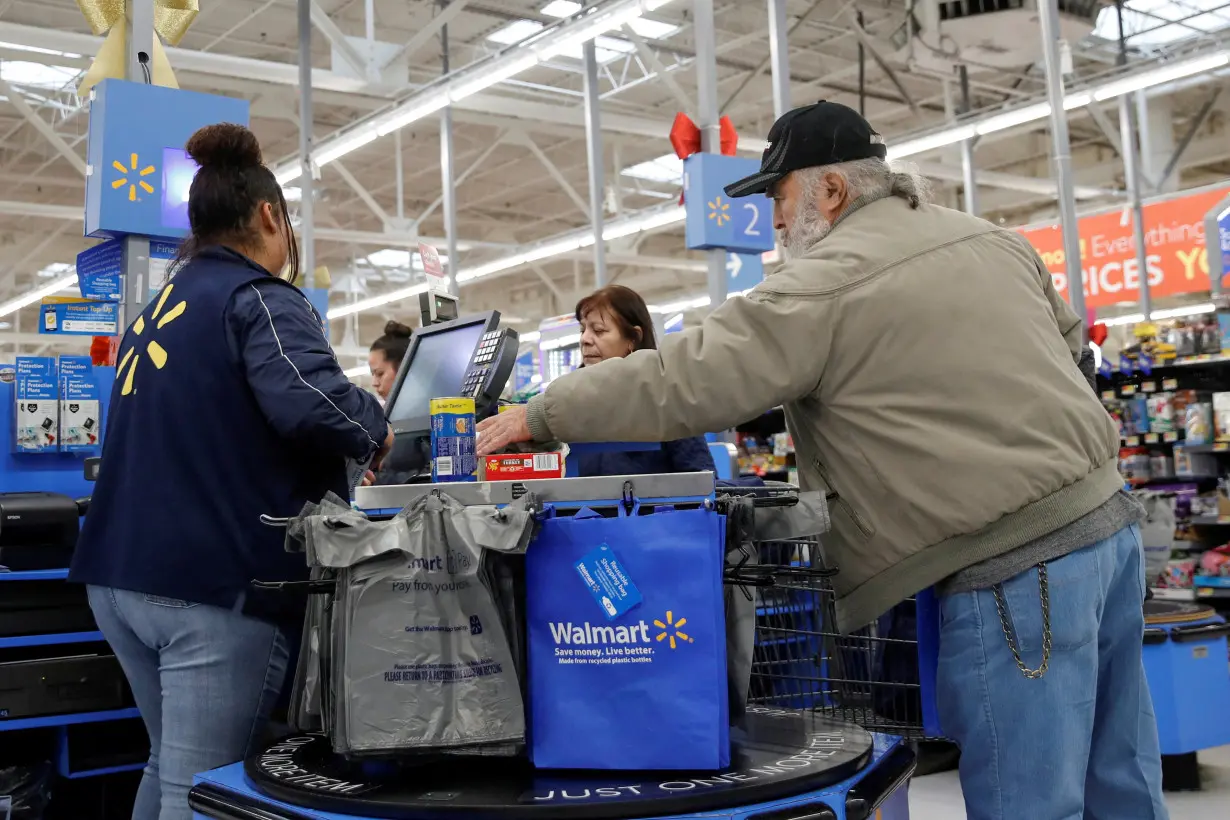 FILE PHOTO: A customer shops at a Walmart store ahead of the Thanksgiving holiday in Chicago