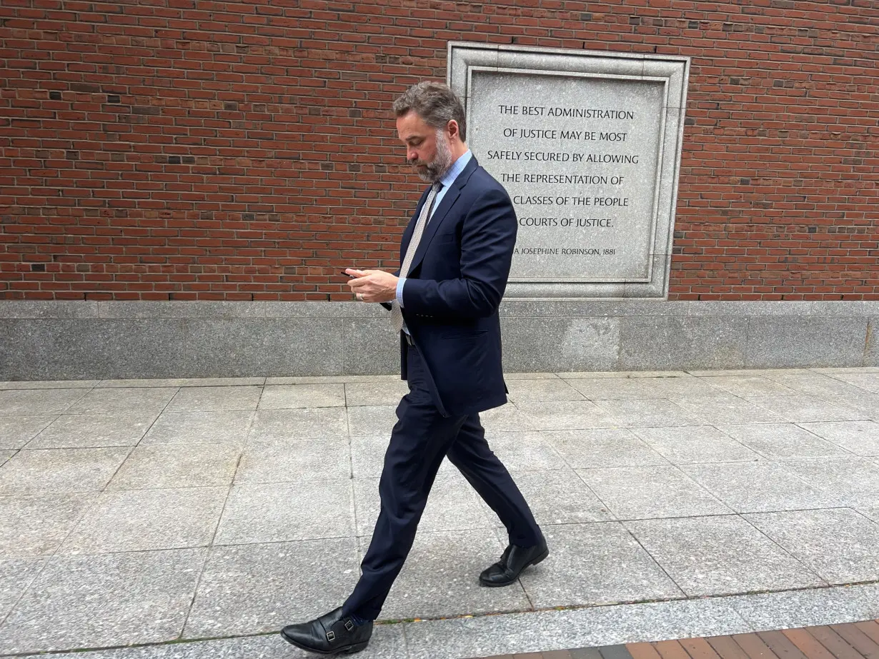 Spirit Airlines CEO Ted Christie exits the federal court in Boston