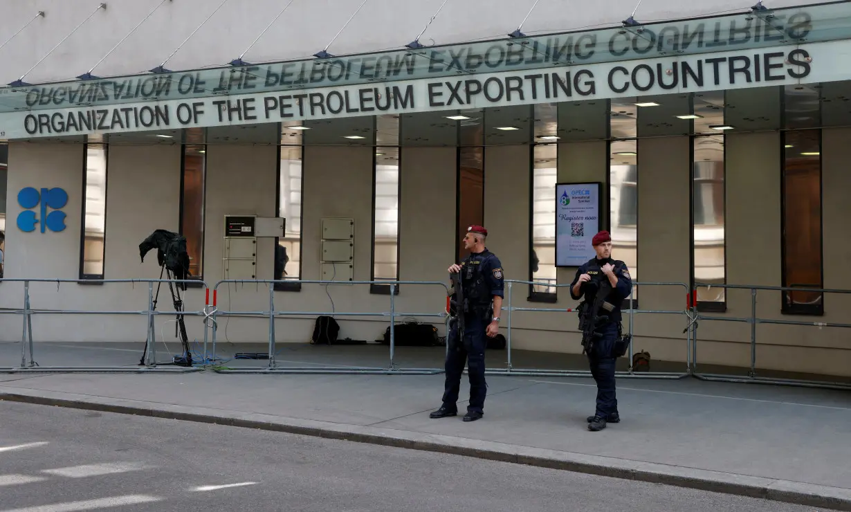 FILE PHOTO: Austrian police officers stand in front of the OPEC headquarters in Vienna