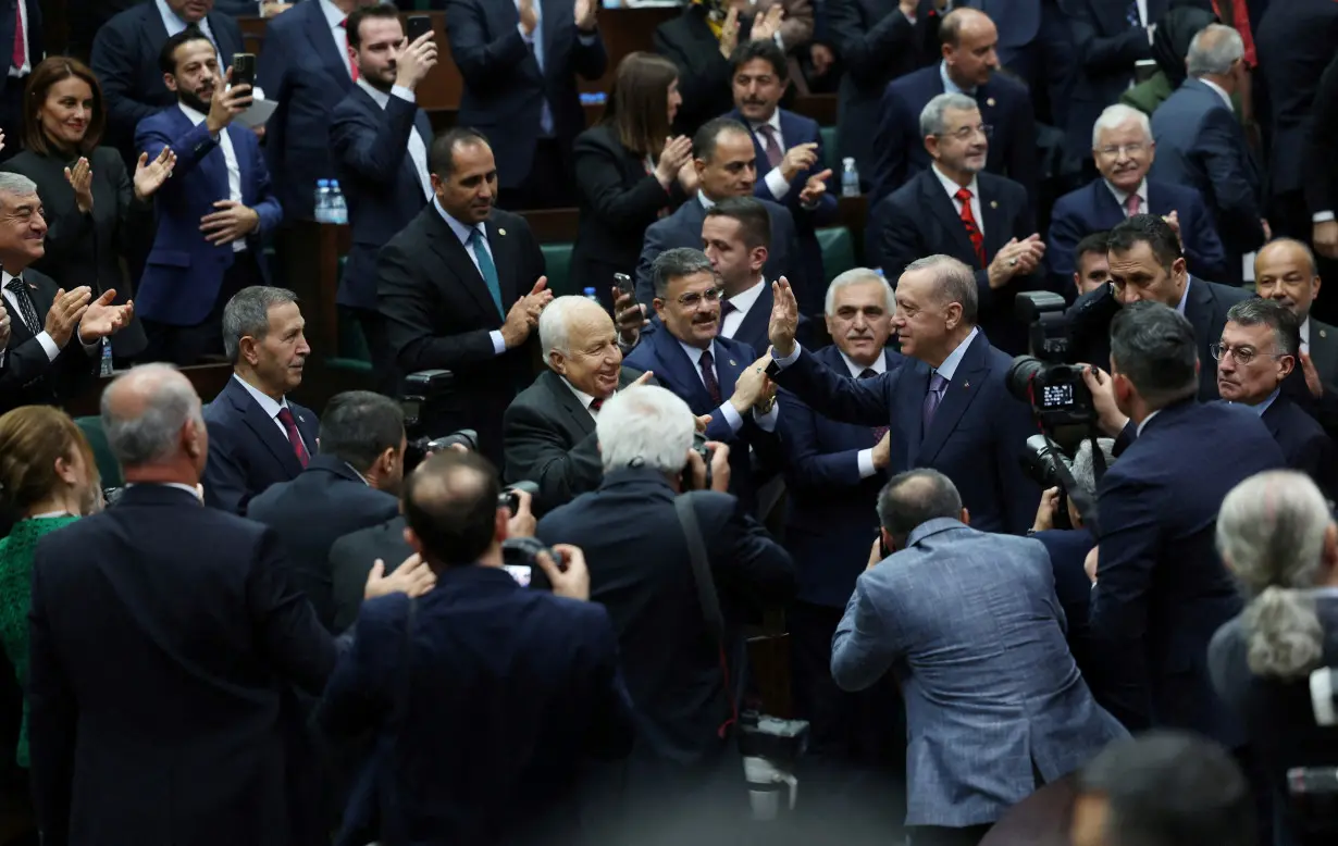 FILE PHOTO: Turkish President Tayyip Erdogan greets lawmakers of his AK Party t in the Turkish parliament in Ankara