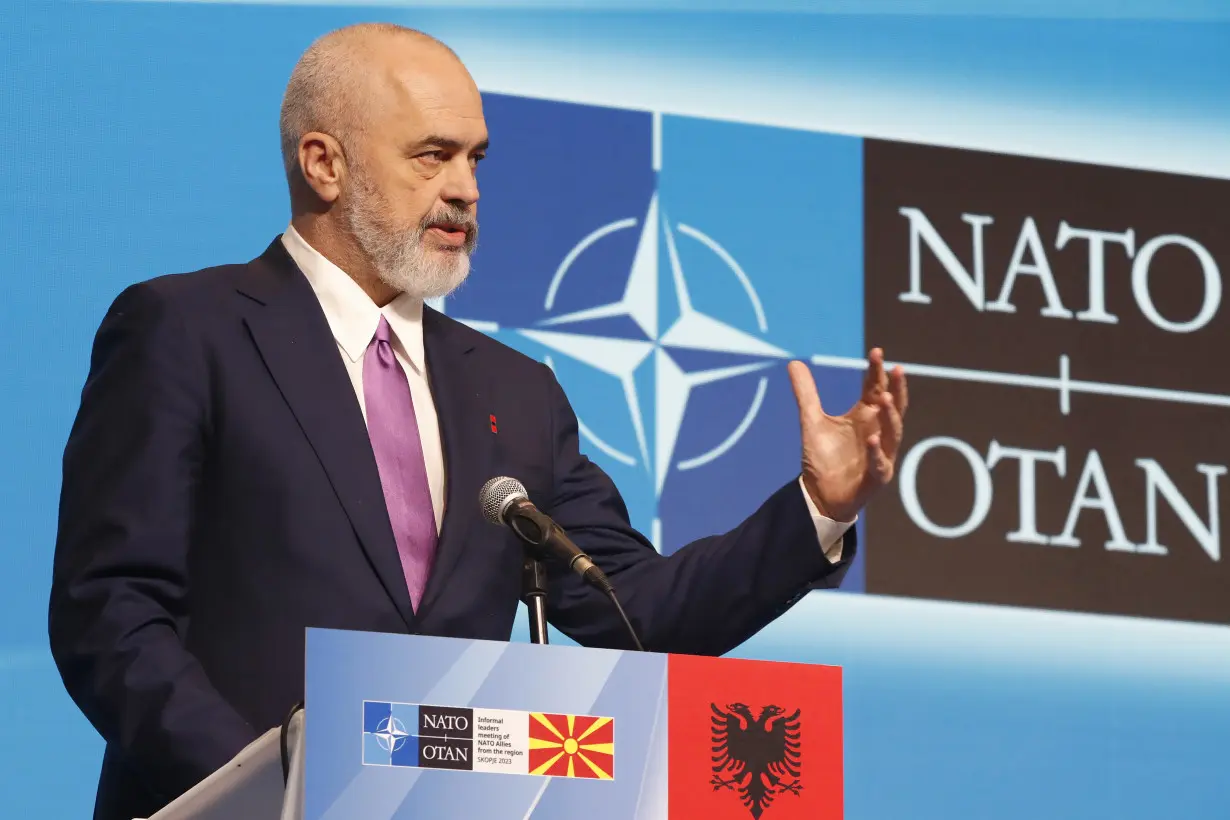 Albania's prime minister calls for more NATO troops in neighboring Kosovo following ethnic violence