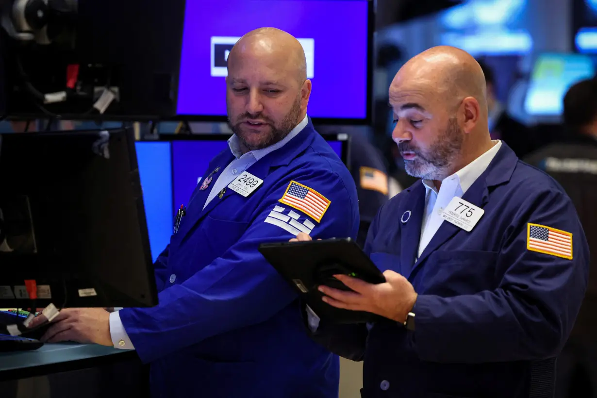 Traders work on the floor of the NYSE in New York