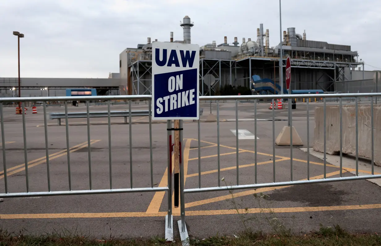 Striking United Auto Worker union members picket outside the Ford Michigan Assembly Plant in Wayne