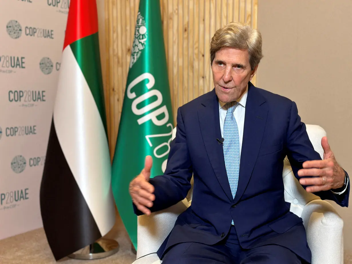 FILE PHOTO: John Kerry, U.S. Special Presidential Envoy for Climate speaks during an earlier interview with Reuters, in Abu Dhabi