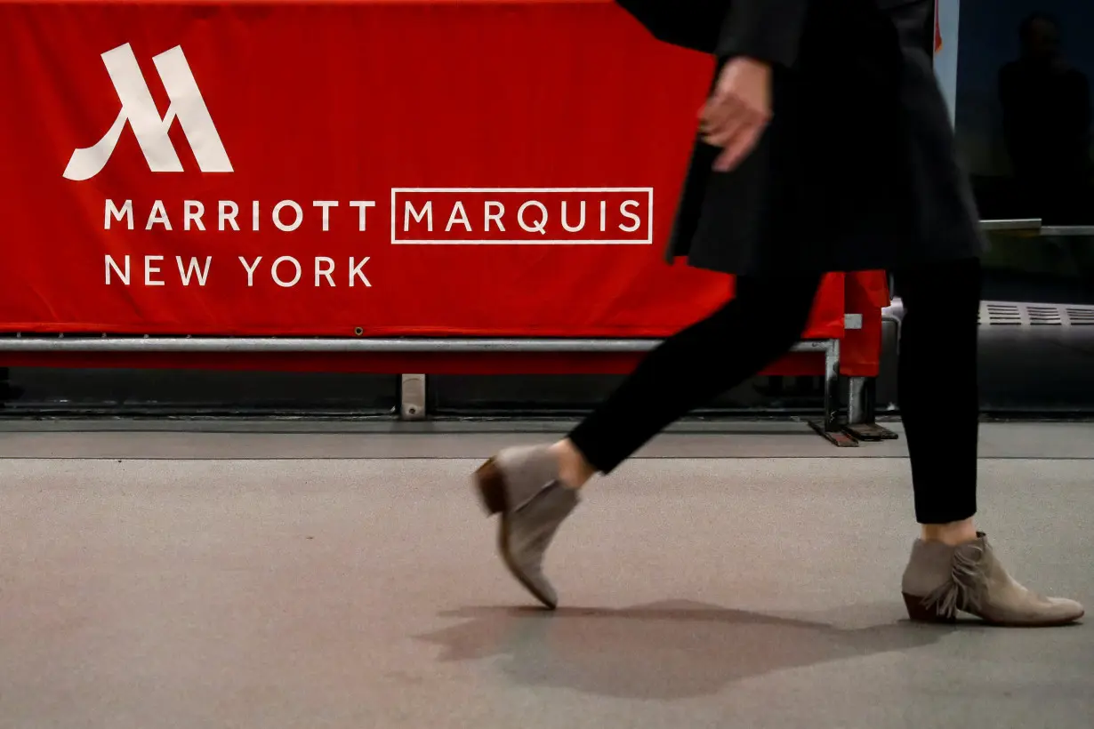 A guest arrives at the Marriott Marquis hotel in Times Square in New York