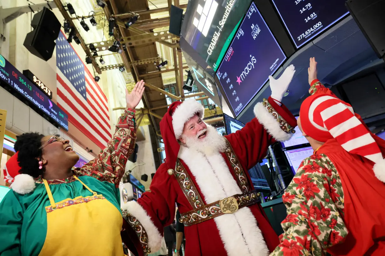 Traders work on the floor of the NYSE in New York