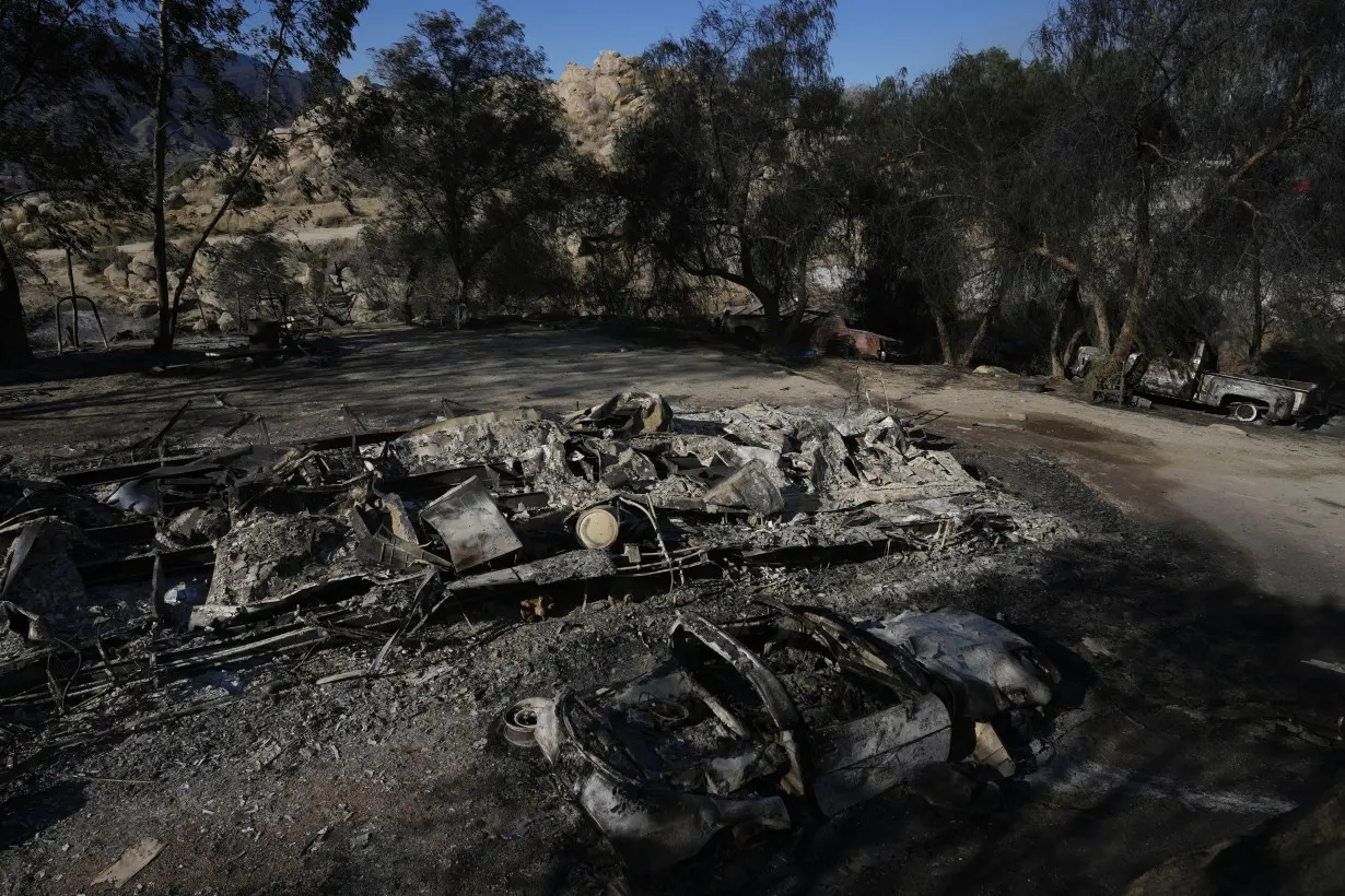 Firefighters make progress battling Southern California wildfire, but homes remain threatened