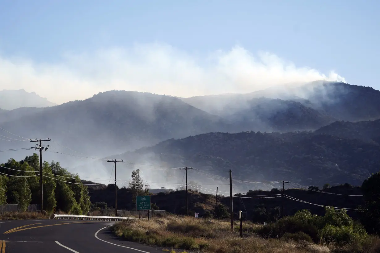 Firefighters make progress battling Southern California wildfire, but homes remain threatened