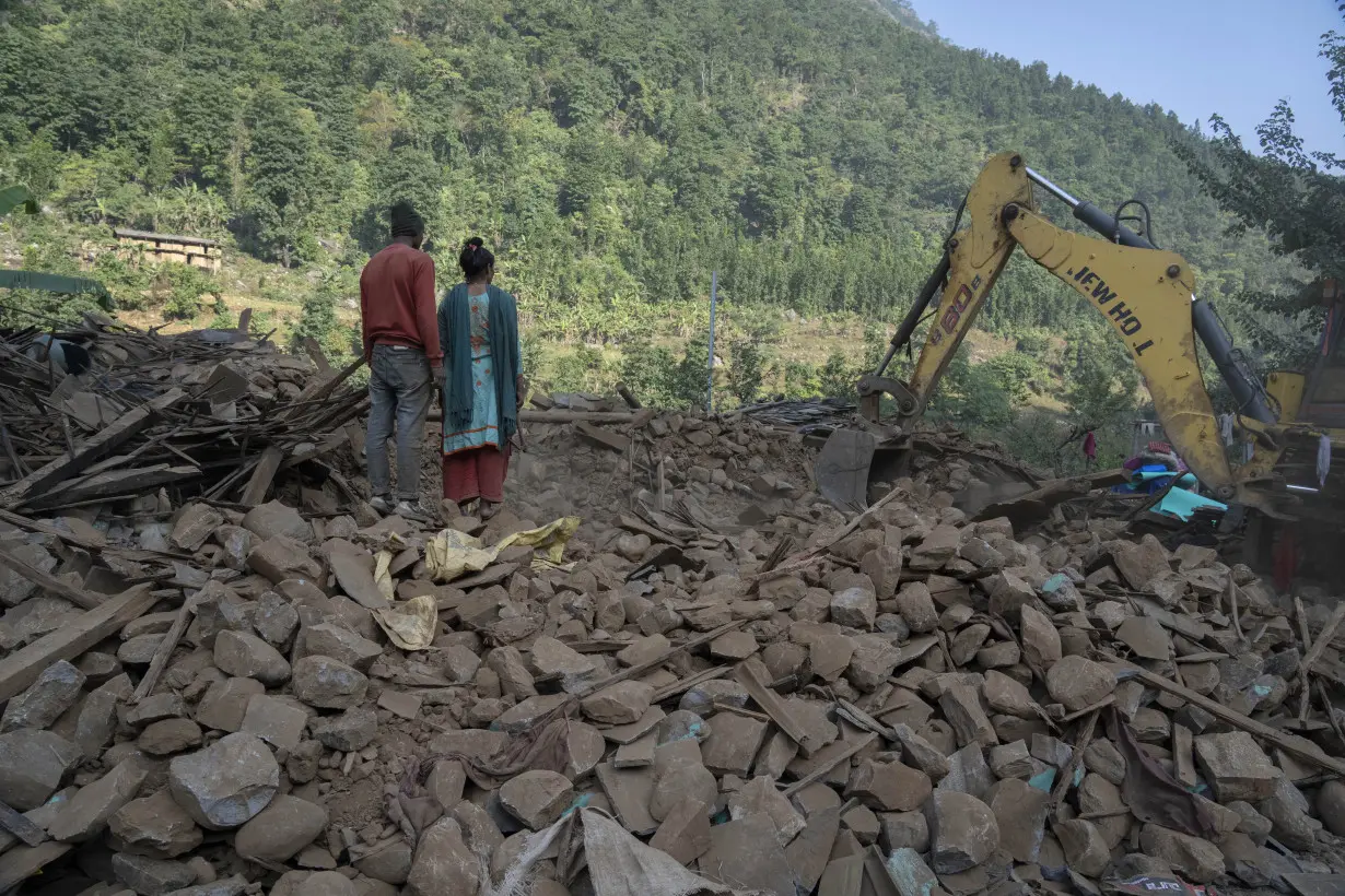 Aid trickles in as survivors salvage belongings from rubble in Nepal villages struck by earthquake