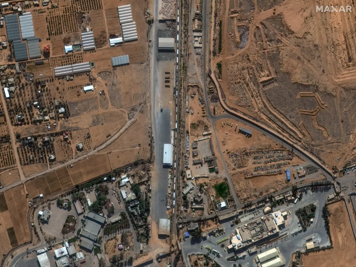 A satellite image shows humanitarian-associated trucks queueing to enter the Rafah border crossing