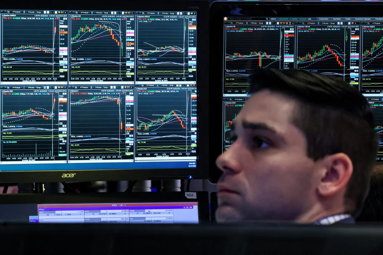 Traders work on the floor of the NYSE in New York