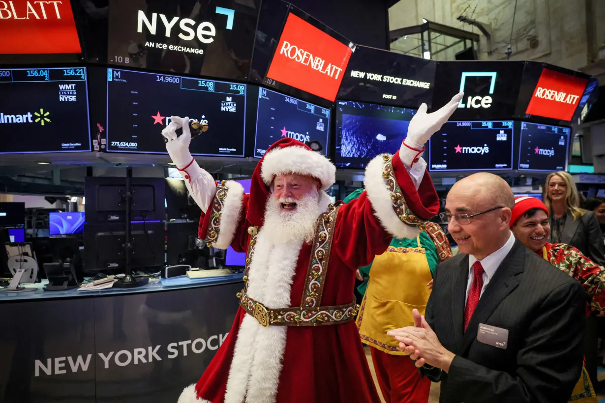 Traders work on the floor of the NYSE in New York