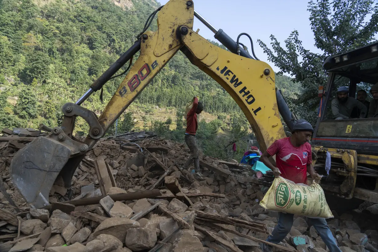 Aid trickles in as survivors salvage belongings from rubble in Nepal villages struck by earthquake