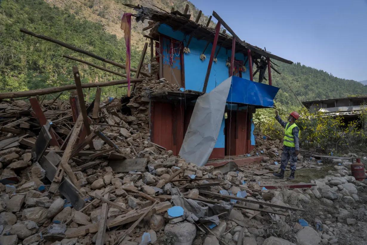 Aid trickles in as survivors salvage belongings from rubble in Nepal villages struck by earthquake