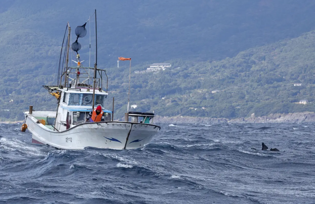 An object believed to belong to the U.S. military aircraft V-22 Osprey that crashed into the sea floats off Yakushima Island