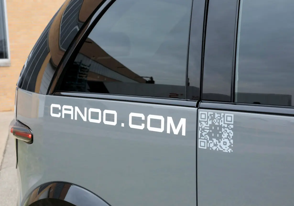 A view shows the Canoo logo on a Canoo LV (Lifestyle Vehicle) electric vehicle