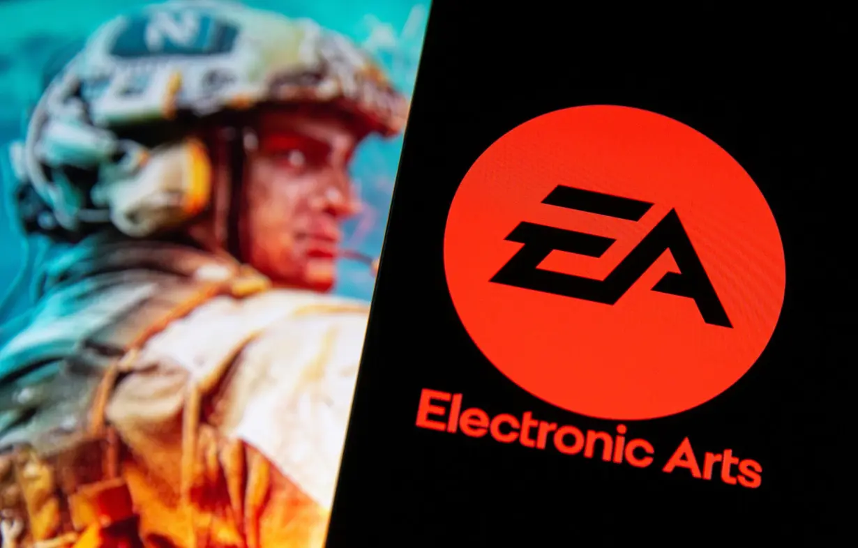 A smartphone with the Electronic Arts logo is seen in front of a displayed character from the Battlefield 2042 game in this illustration