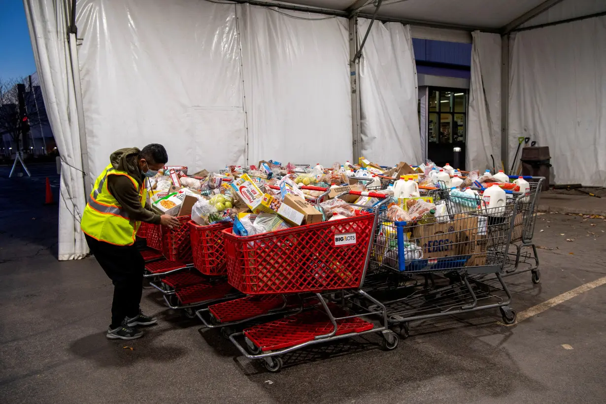 FILE PHOTO: People receive donations at a food bank in Ohio