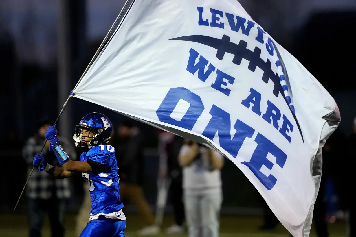 High school football rivals in Maine come together in emotional game after mass shooting