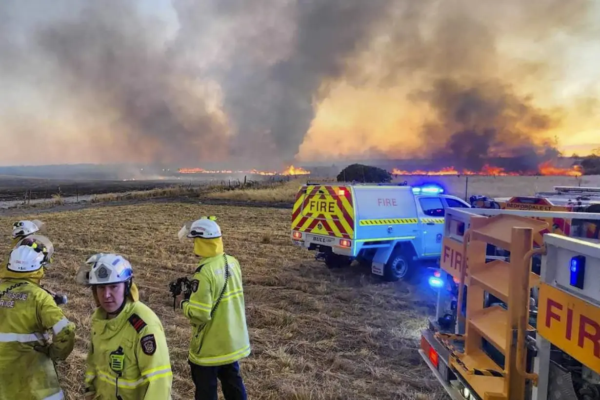 Dozens evacuate and 10 homes are destroyed by a wildfire burning out of control on the edge of Perth