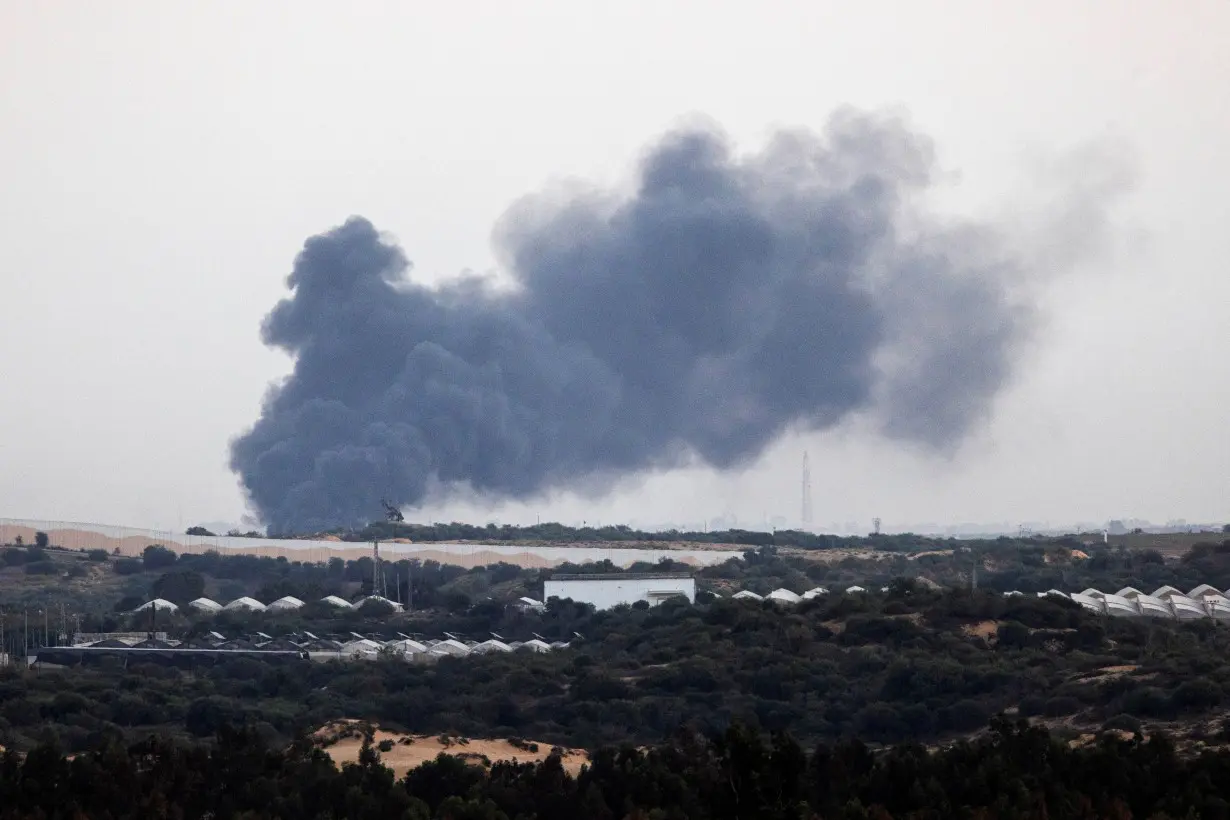 Smoke rises above the Gaza Strip as seen from Israel's border with Gaza