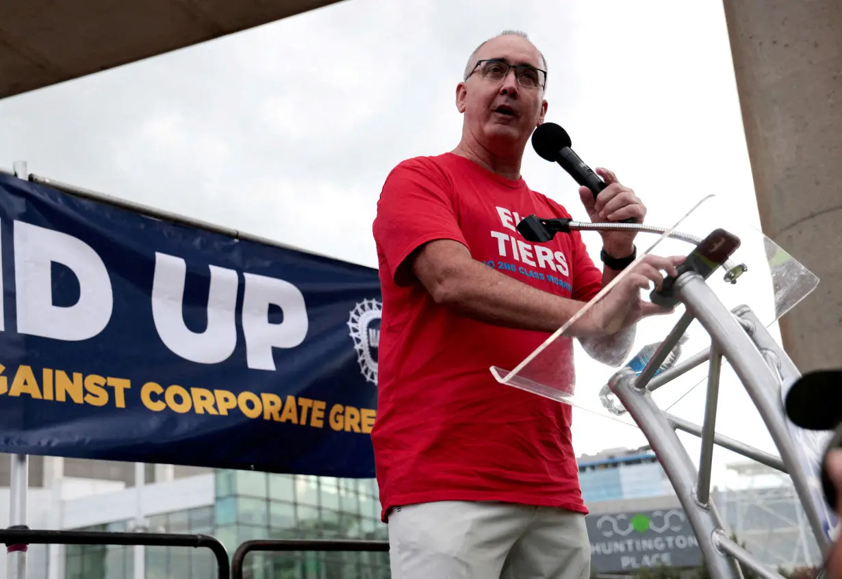 FILE PHOTO: United Auto Workers President Shawn Fain addresses the audience during a rally in support of striking UAW