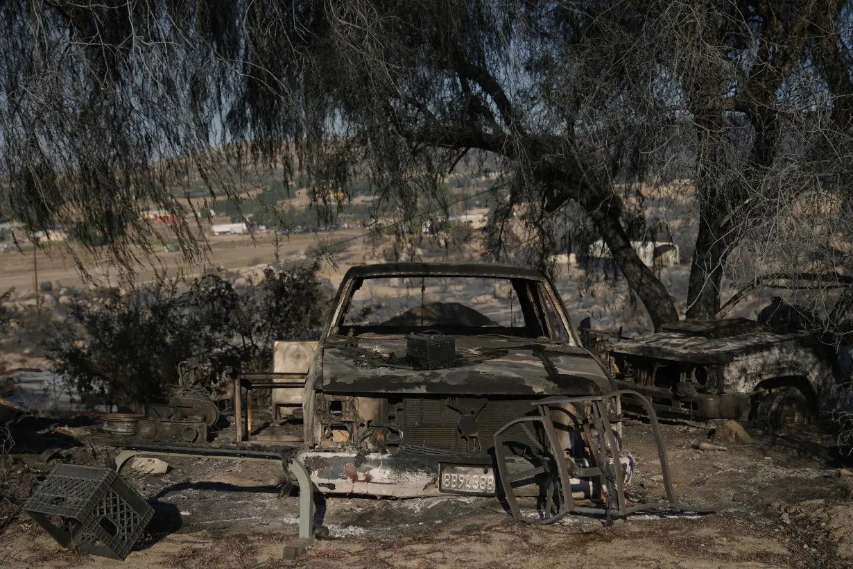 Firefighters make progress battling Southern California wildfire, but homes remain threatened