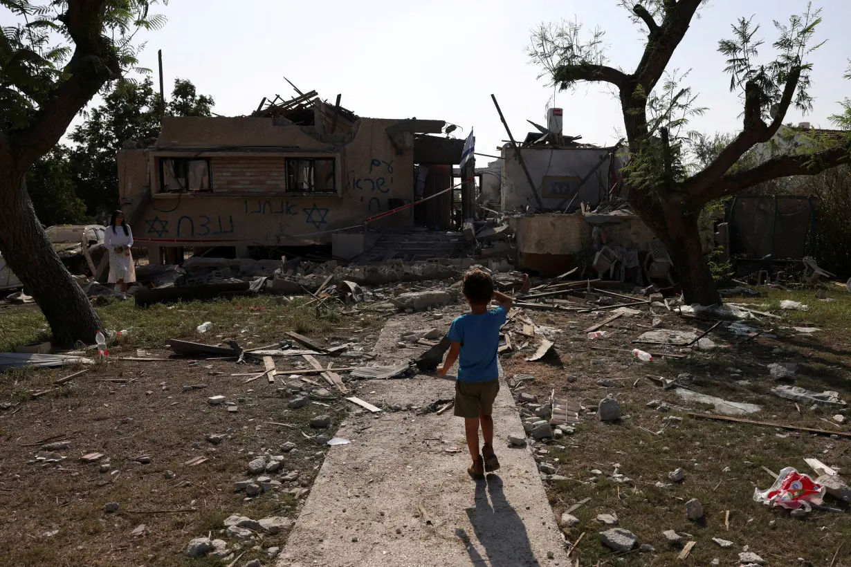 A rocket fired from the Gaza Strip damages a home, in central Israel