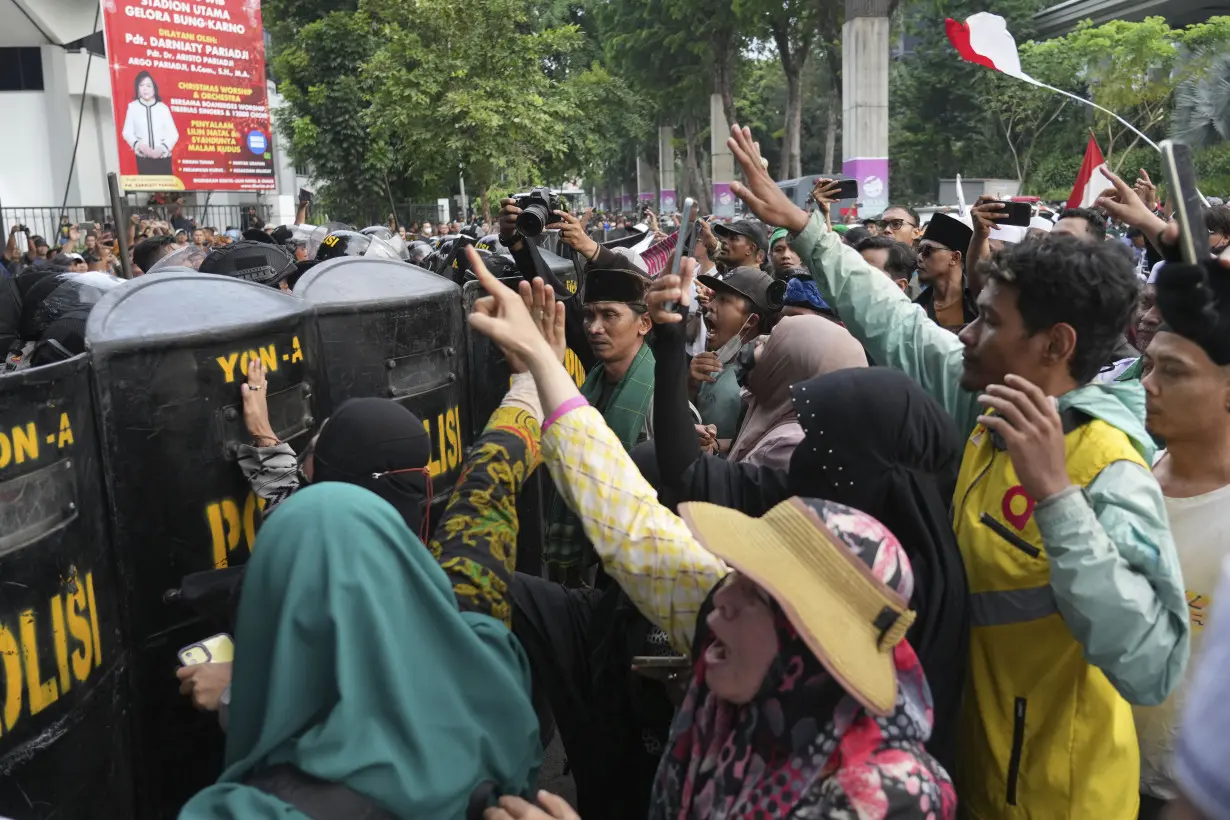 Conservative Muslims in Indonesia protest Coldplay concert over the band's LGBTQ+ support