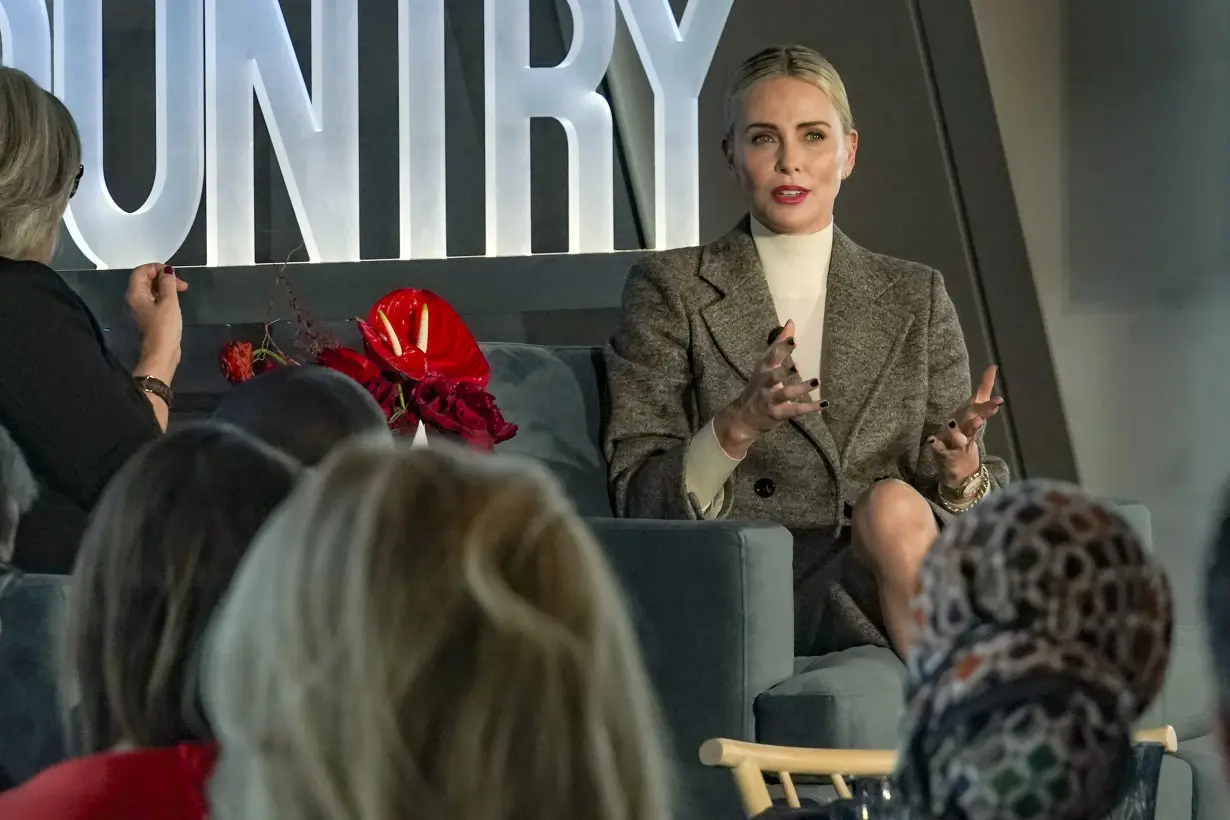 Charlize Theron encourages people to find ways to help through philanthropy at Town & Country summit