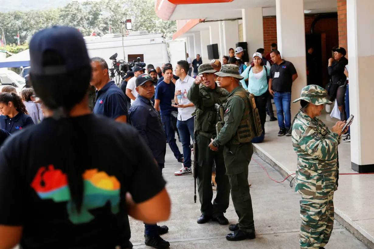 FILE PHOTO: Venezuelans participate in an electoral simulation of a referendum over disputed territory, in Caracas