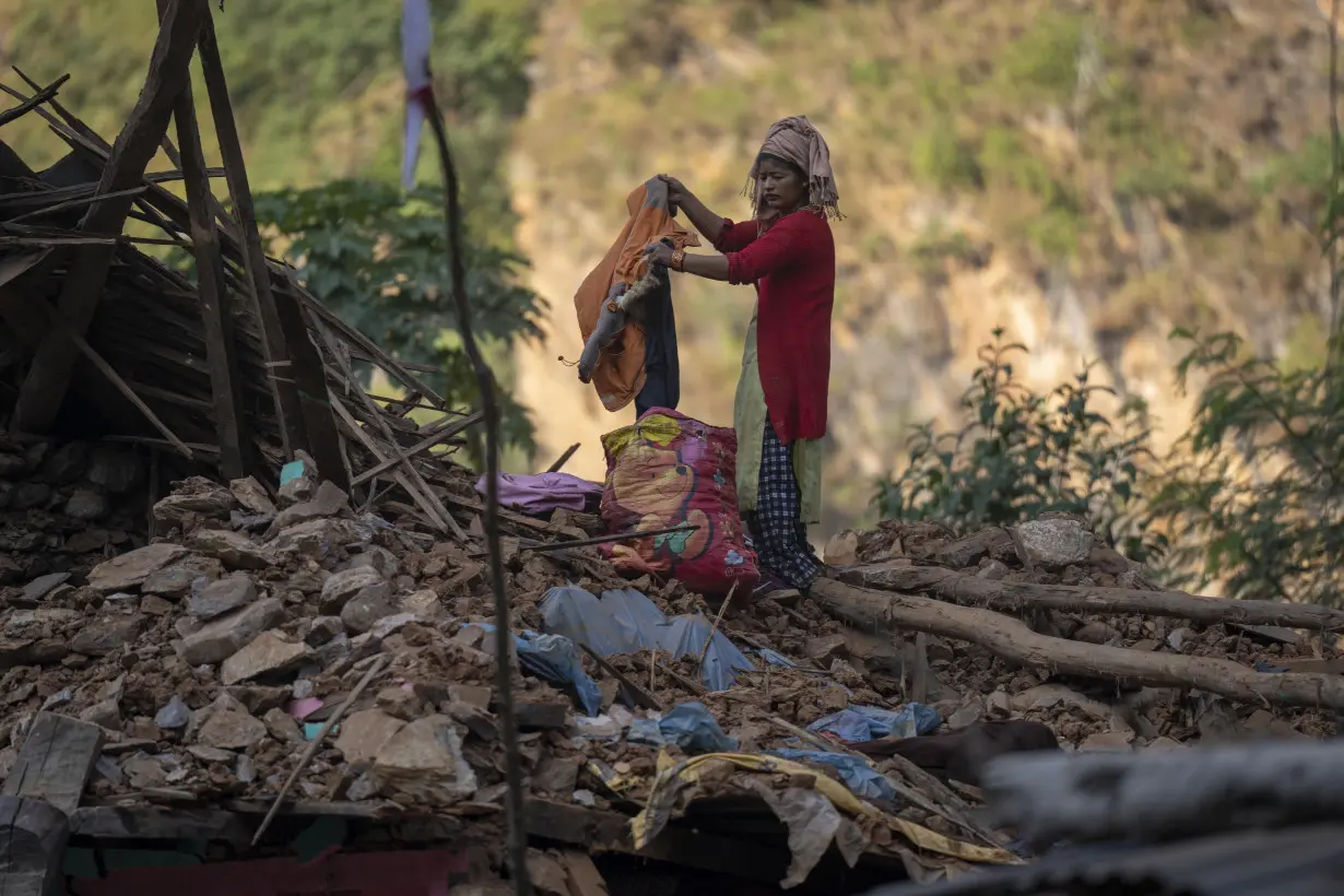 Aid trickles in as survivors salvage belongings from rubble in Nepal villages struck by earthquake