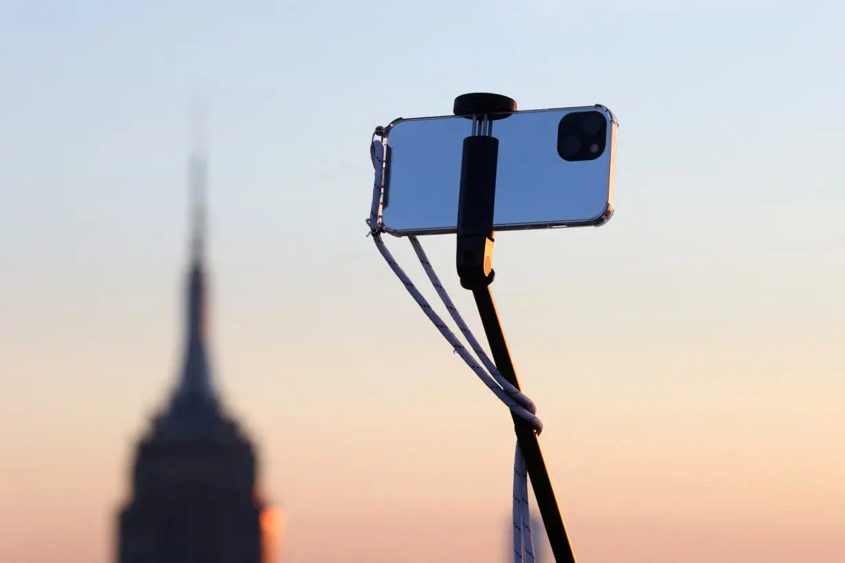 FILE PHOTO: A smartphone is seen on a selfie stick in Manhattan, in New York City