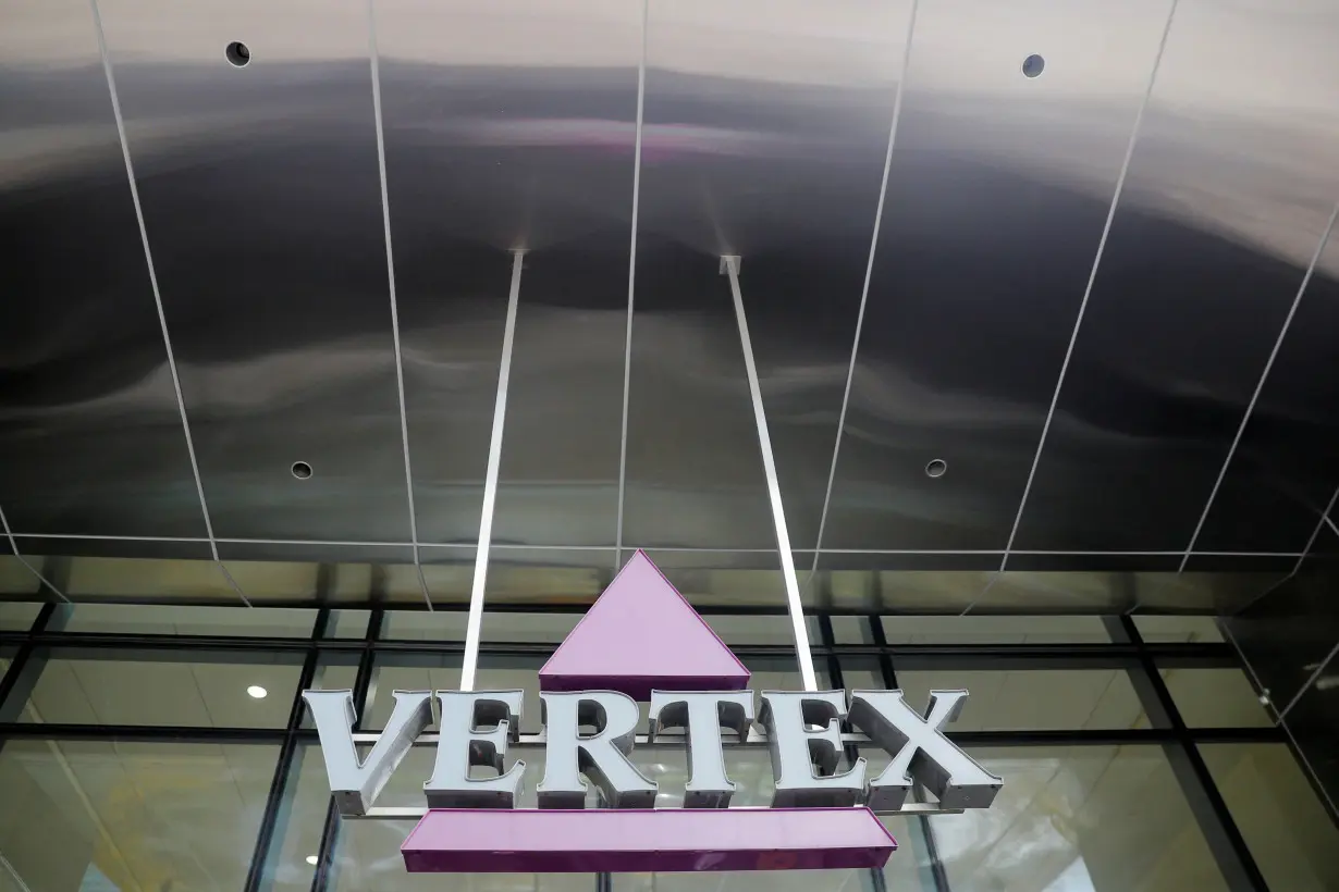 FILE PHOTO: A sign hangs in front of the world headquarters of Vertex Pharmaceuticals in Boston