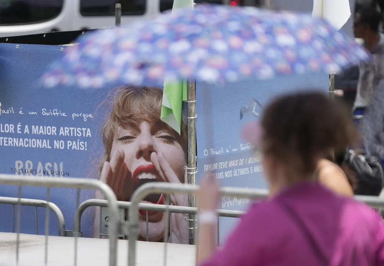 Taylor Swift postpones Rio de Janeiro show, citing record heat a day after fan dies during concert