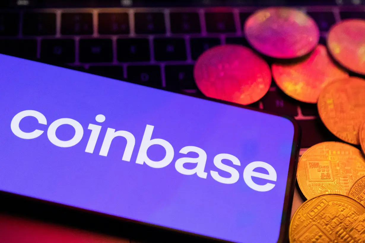 FILE PHOTO: Illustration shows smartphone with displayed Coinbase logo