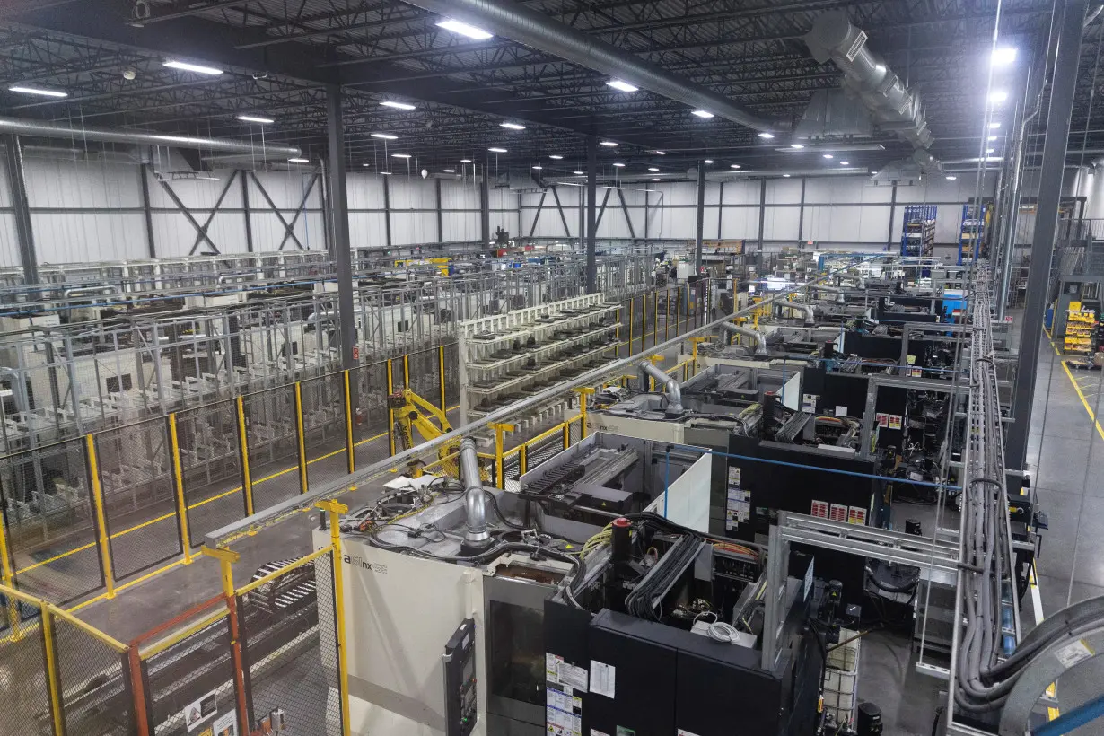 FILE PHOTO: A general view of the factory floor and numerous automated machines used in the production and manufacturing of aircraft parts, at Abipa Canada in Boisbriand