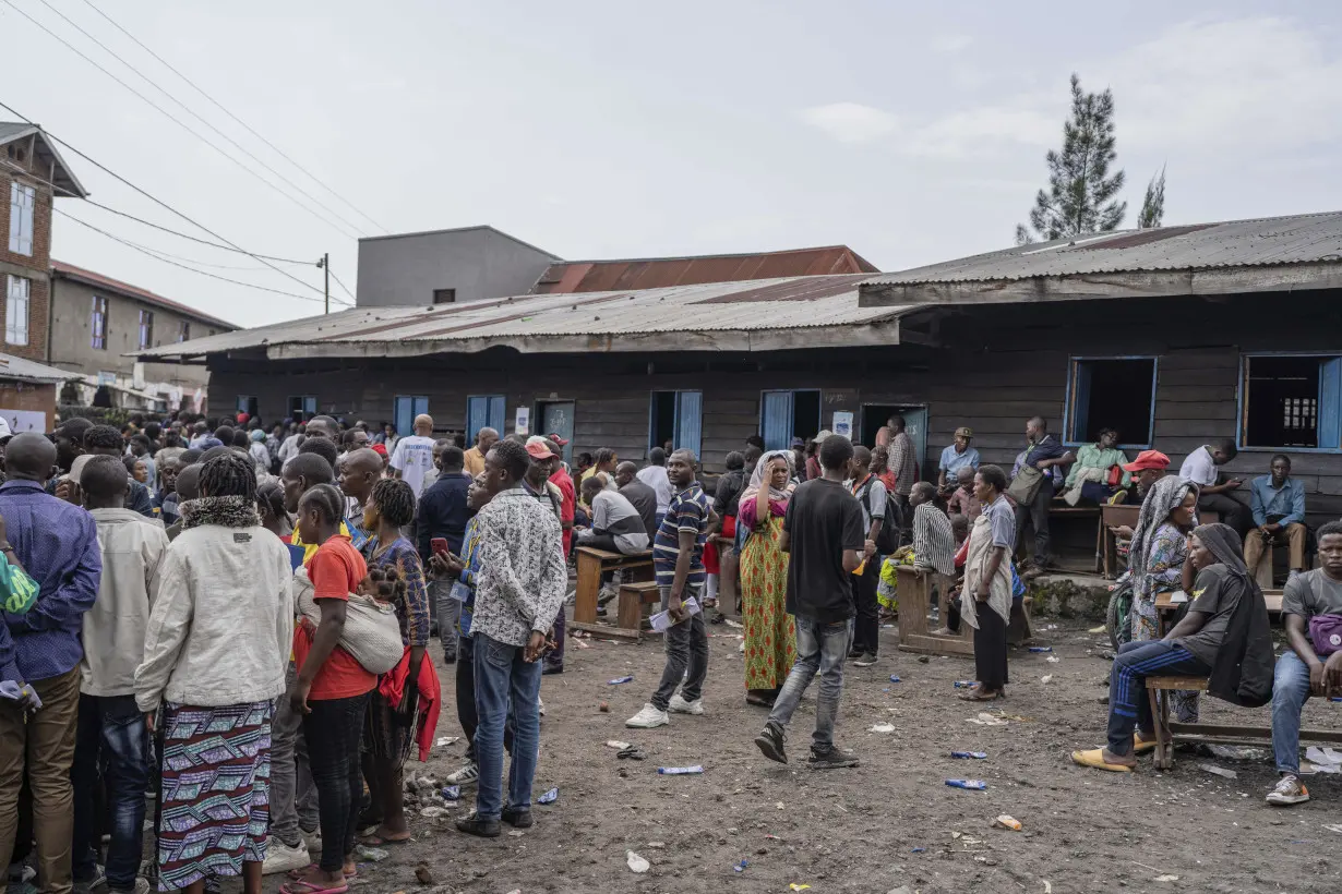 Congo conducts a 2nd day of voting after delays and closed polls keep people from casting ballots