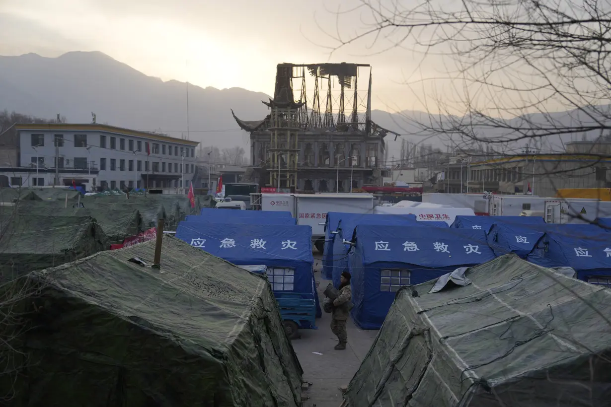 China has started erecting temporary housing units after an earthquake destroyed 14,000 homes