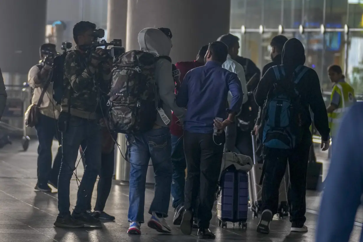 276 Indians stuck in a French airport for days for a human trafficking probe arrive in India