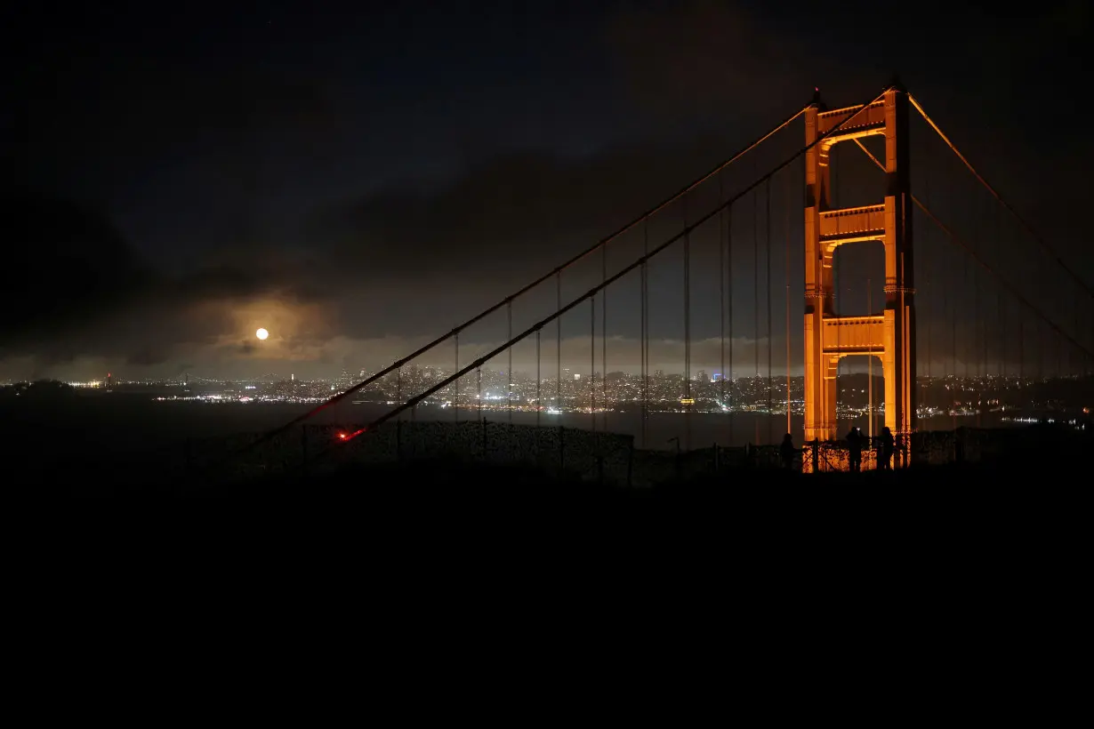 FILE PHOTO: The Moon rises over the Golden Gate Bridge in San Francisco