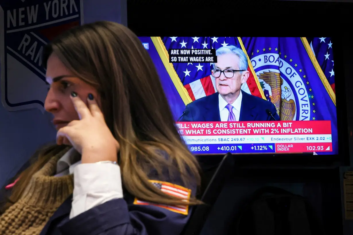 Traders react to Fed rate announcement on the floor of the NYSE in New York