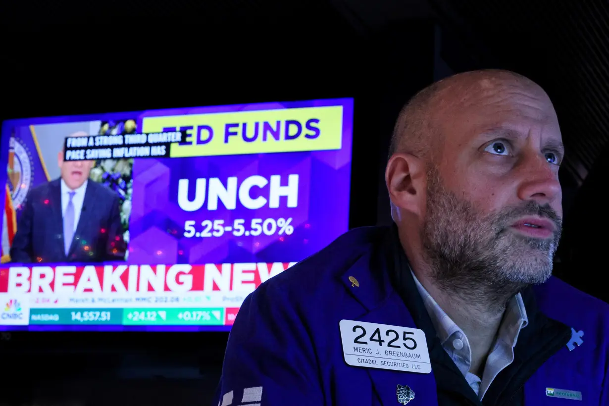 Traders react to Fed rate announcement on the floor of the NYSE in New York