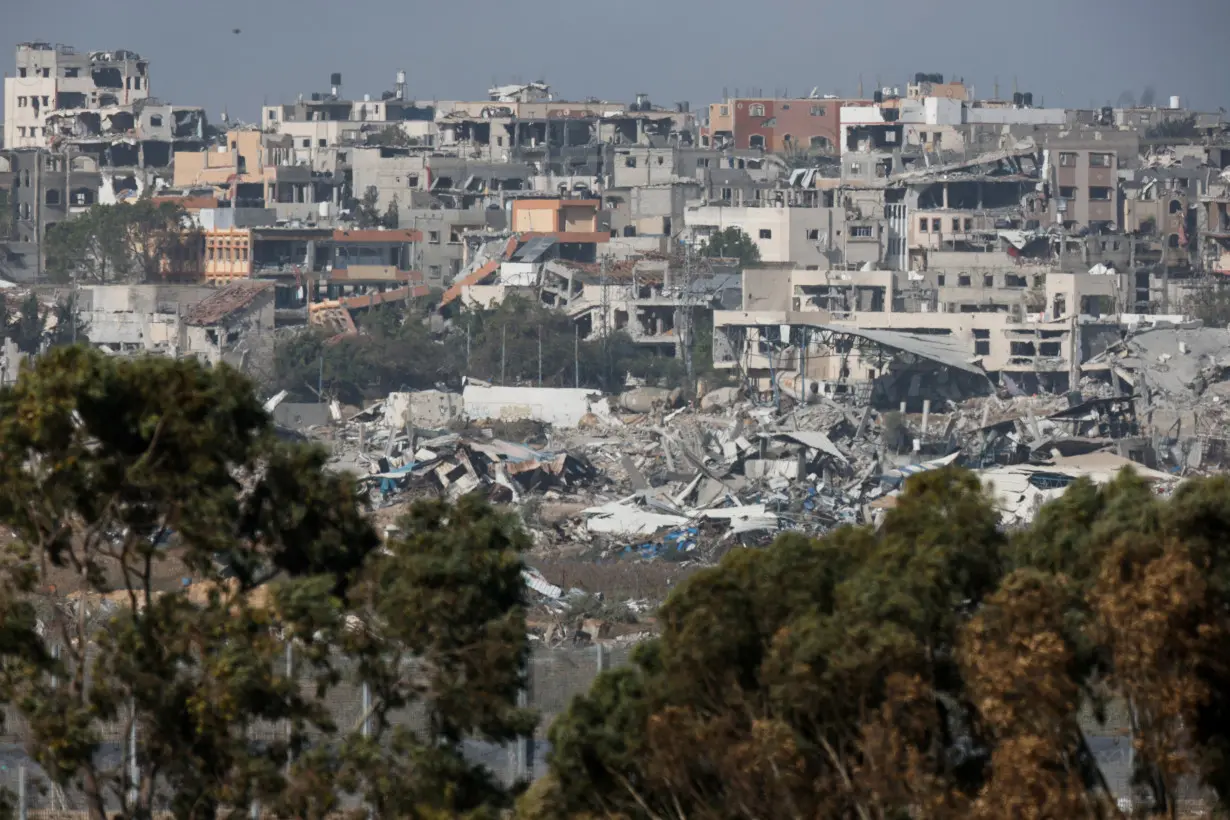 Destroyed buildings lie in ruin in Gaza, as seen from Israel